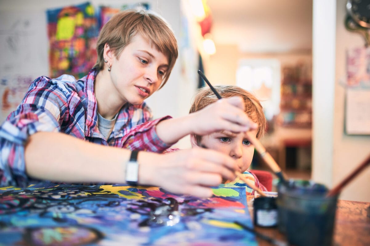 Early years practitioner with a child
