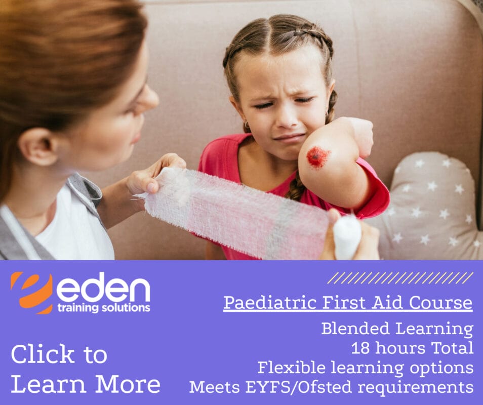 Teacher giving paediatric first aid